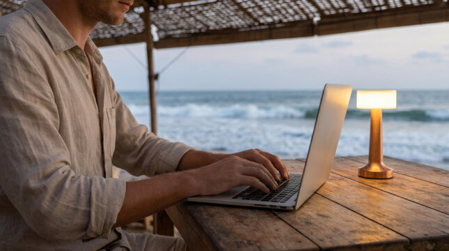 Beachfront laptop cafe work ocean lamp table coast sunset remote work