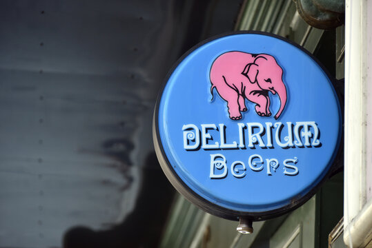 Montlu&ccedil;on - France - 2 August 2026 - Delirium Beer sign displayed on the facade of a bar in France. Exterior view featuring the well-known Belgian beer brand signage. Editorial use only.
