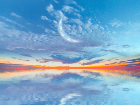 Ramadan Concept - Abstract background with Crescent moon over the sunset clouds