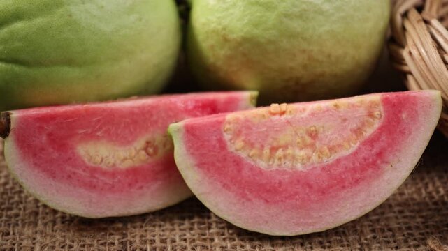 Fresh red-fleshed guavas in a basket