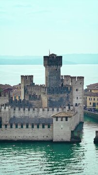 Sirmione old town and Scaliger Castle on Lake Garda. Scenic Italian destination with historic architecture