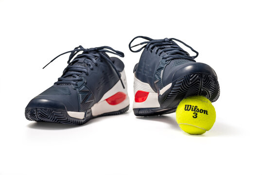 Belgrade, Serbia - September 22, 2025: Blue Wilson Rush Pro Ace Tennis Shoes with Wilson tennis ball isolated on white background with clipping path included