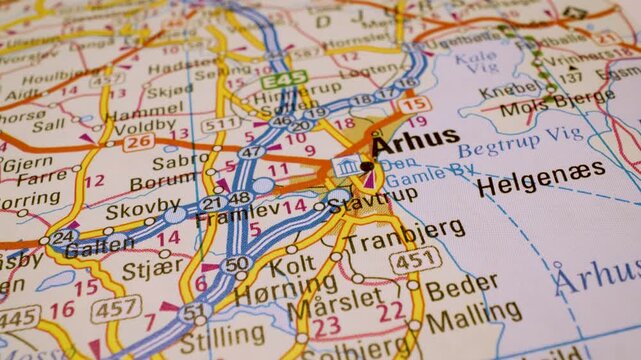 road network to aarhus, denmark, gliding macro view over atlas map