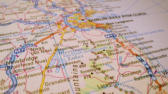 road network to dublin, ireland, gliding macro view over atlas map