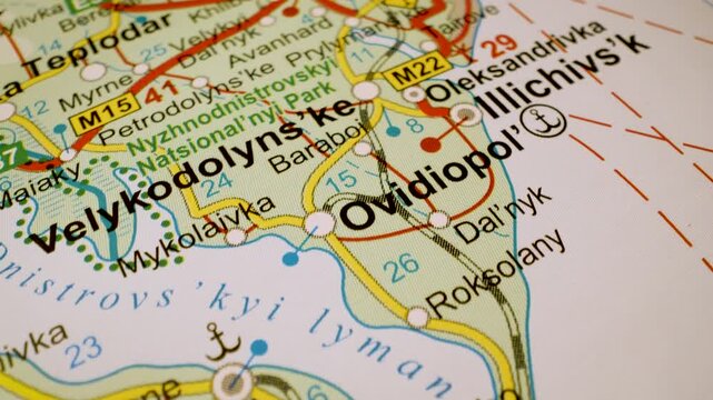 road network to odesa, ukraine, gliding macro view over atlas map
