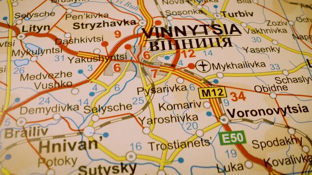 road network to vinnytsia, ukraine, gliding macro view over atlas map