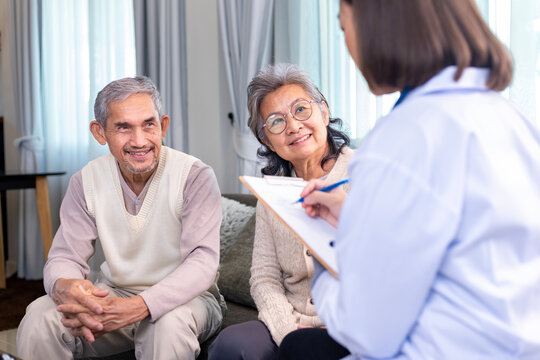 Senior couple got medical service visit from caregiver doctor at home while having result of medical exam for health care and pension welfare insurance