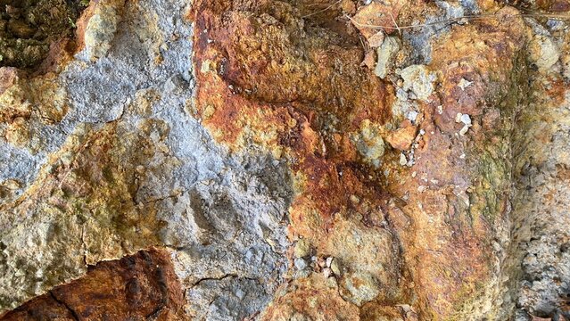Close up of natural orange brown rock mineral stone texture background