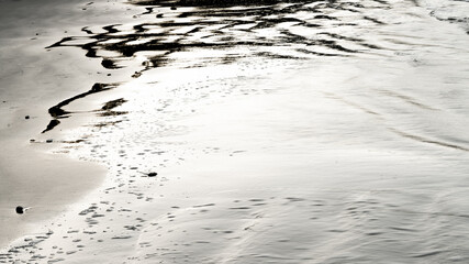 Abstract wet sand texture with natural patterns © The Long Horizon
