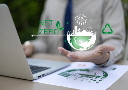 Business leaders display environmental symbols representing goals including ESG, CO2, circular economy, and net-zero greenhouse gas emissions. Environment, Sustainability, Recycling, Green Energy