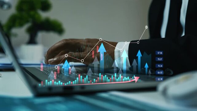 Business person using a laptop with hologram glowing charts and rising arrows animation on the screen, Business data growth, finance planning, market analysis and digital business success
