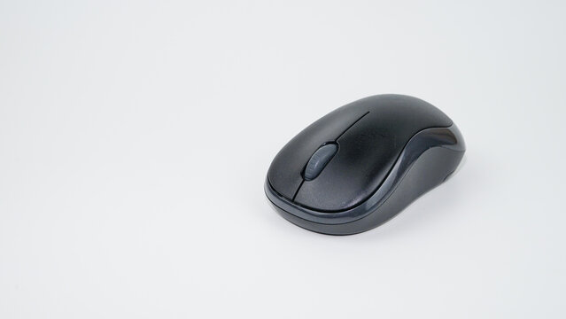 Black wireless computer mouse on a white background