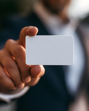 businessperson presenting a customizable plastic card mockup, branding template, financial services, modern identity solution, minimal background, commercial product photography