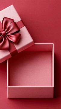 Red gift box with satin ribbon and empty open gift box on red background, luxury present packaging mockup with copy space
