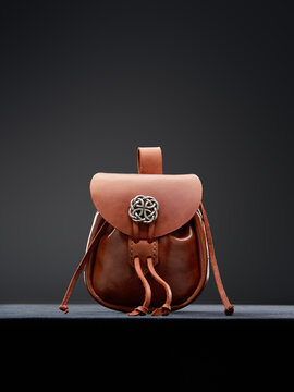 Handcrafted Brown Leather Pouch with Intricate Silver Celtic Knot Accessory