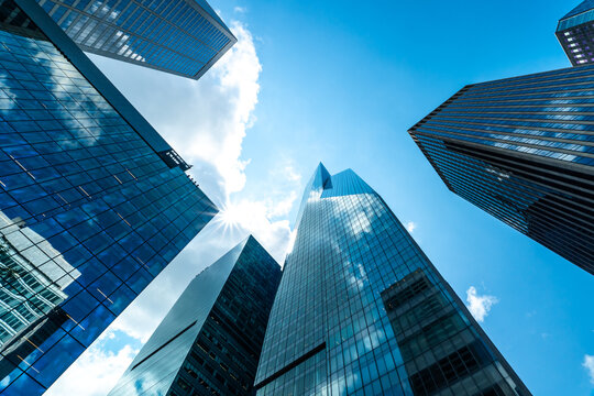 Low Angle View of Modern Glass Skyscrapers Under Blue Sky in Financial District