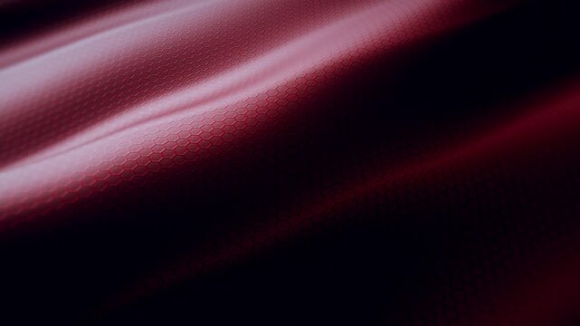 Widescreen loop of red hexagonal embossed leather-style material with rippling light waves, premium automotive and luxury interior texture background