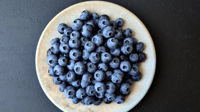 Fresh, ripe, and juicy wild blueberries as an ingredient for vegetarian dishes. Blueberries as a food background for your design
