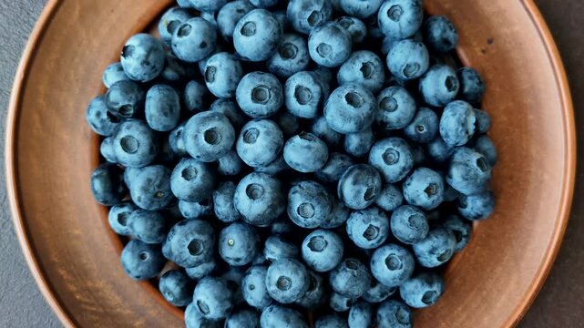 Fresh, ripe, and juicy wild blueberries as an ingredient for vegetarian dishes. Blueberries as a food background for your design