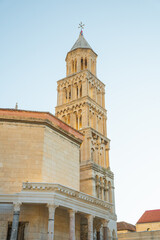 Obraz premium Bell tower of Saint Domnius Cathedral in Split, Croatia. Historic stone architecture in Diocletian's Palace complex under clear sky.