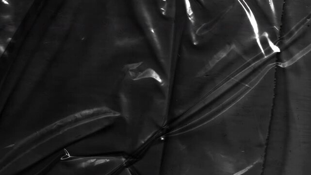 Plastic Overlay Background Featuring Glossy Film Texture and Abstract Reflections