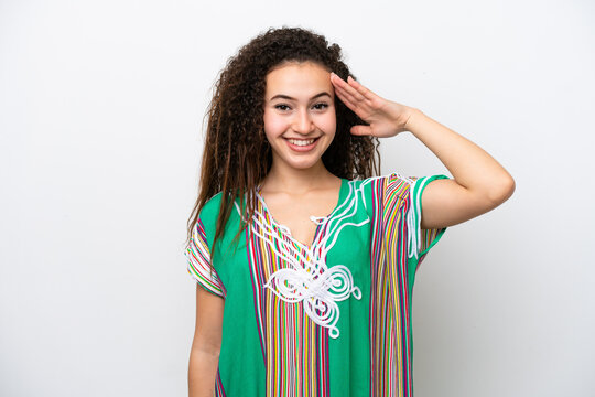 Young Arab woman isolated on white background saluting with hand with happy expression
