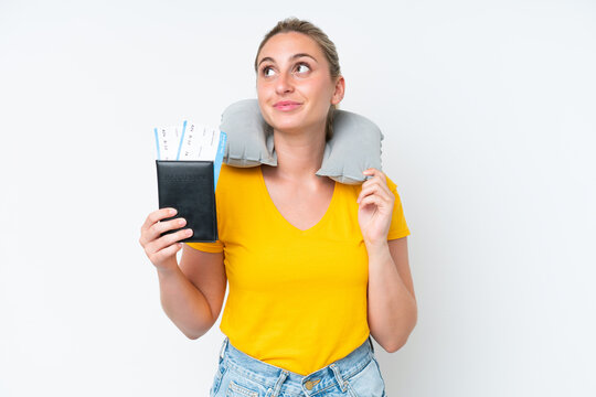 Woman with Inflatable Travel Pillow thinking an idea while looking up