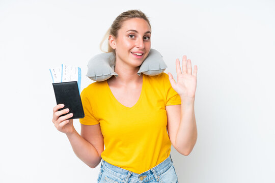 Woman with Inflatable Travel Pillow saluting with hand with happy expression