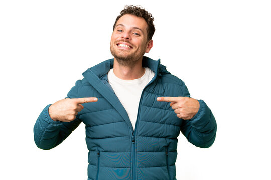 Brazilian man over isolated chroma key background proud and self-satisfied