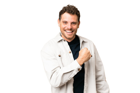 Brazilian man over isolated chroma key background celebrating a victory