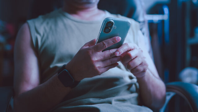 Person holding phone typing indoors evening communication digital network connection social media app mobile internet browsing user interaction tech lifestyle platform connectivity usage system task.