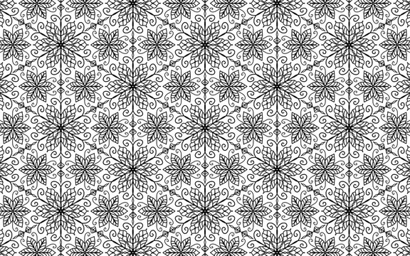 Intricate black and white floral snowflake pattern with swirling decorative elements