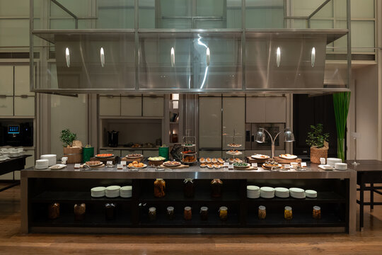 Luxury Hotel Buffet Counter with Dessert and Pastry Display in Modern Restaurant