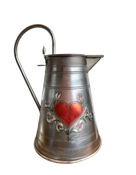 Vintage metal pitcher with red heart and floral engraving isolated on transparent background PNG.