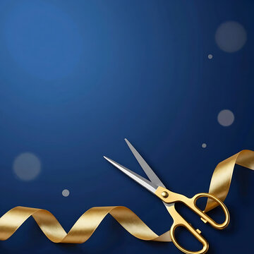 Golden scissors cutting a silk ribbon on blue background