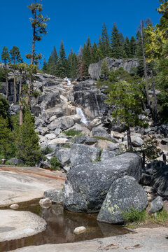 Bassi Falls flows over rocks in forest setting,  Eldorado National Forest, California, USA