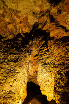 Natural stalactite and stalagmite formations inside an underground cavern