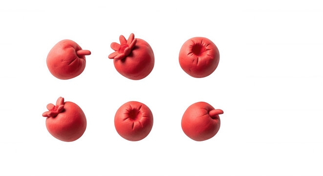 red clay fruits arranged on a white backdrop food art cooking concepts