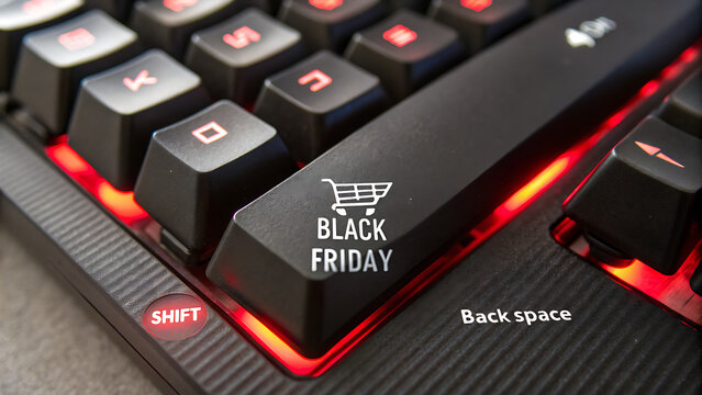 Black Friday Online Shopping Concept with Backlit Keyboard and Shopping Cart Enter Key