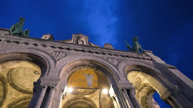 Fine art night view of Sacr&Egrave;-C&uacute;ur Basilica exterior.