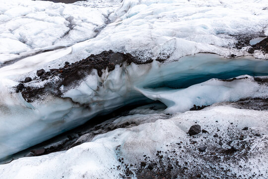 Skaftafell Glacier blue crevasse and moraine rocks in Iceland
