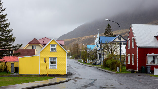 Traditional colorful house street view with Blue Church in Seydisfjordur, Iceland