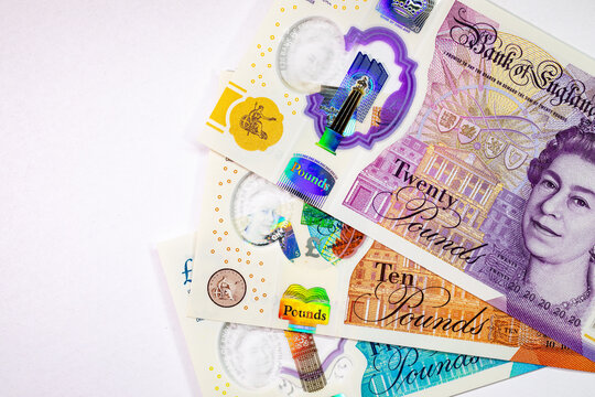 British currency, featuring various Great Britain Pound (GBP) banknotes including 5, 10, and 20 pound notes with Queen Elizabeth II portrait. Money of Europe.