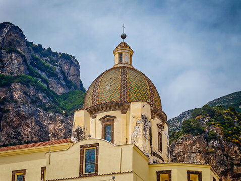 Church of Saint Mary of the Assumption in Positano, Italy, iconic historic church with its colorful majolica dome overlooking the stunning Amalfi Coast
