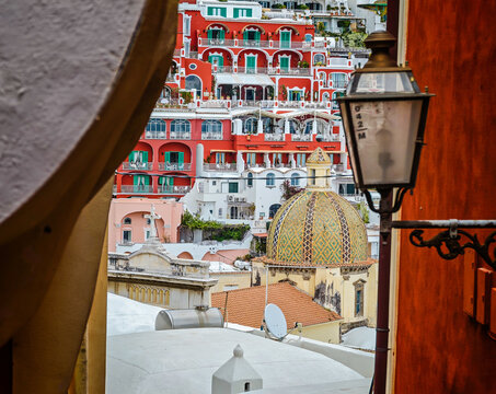 Church of Saint Mary of the Assumption in Positano, Italy, iconic historic church with its colorful majolica dome overlooking the stunning Amalfi Coast
