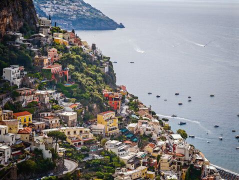 Stunning aerial drone panorama of Positano on the Amalfi Coast, Italy, colorful hillside houses, dramatic cliffs and the Mediterranean Sea