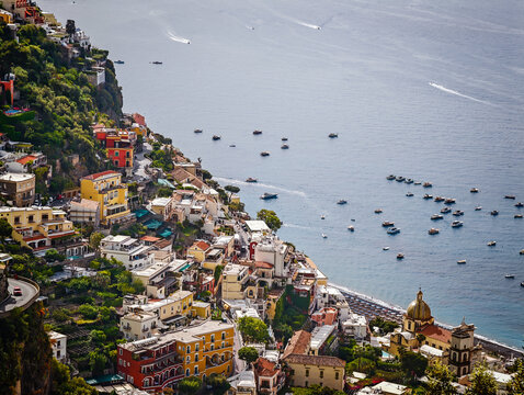 Stunning aerial drone panorama of Positano on the Amalfi Coast, Italy, colorful hillside houses, dramatic cliffs and the Mediterranean Sea