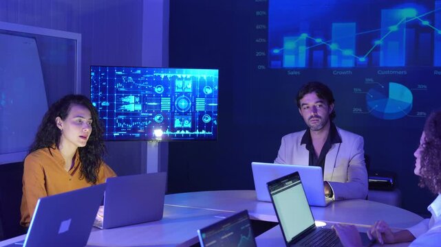 Business professionals collaborating in a modern office, analyzing digital dashboards and financial data, discussing market trends, business performance, data visualization, strategic planning.