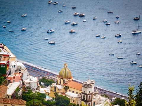 Church of Saint Mary of the Assumption in Positano, Italy, iconic historic church with its colorful majolica dome overlooking the stunning Amalfi Coast