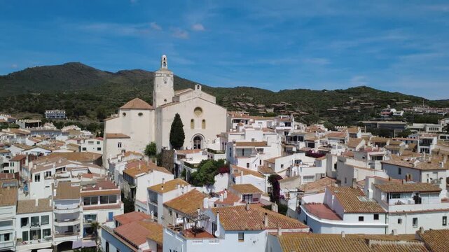 Aerial views of Cadaqu&eacute;s village and its iconic white church on the Costa Brava